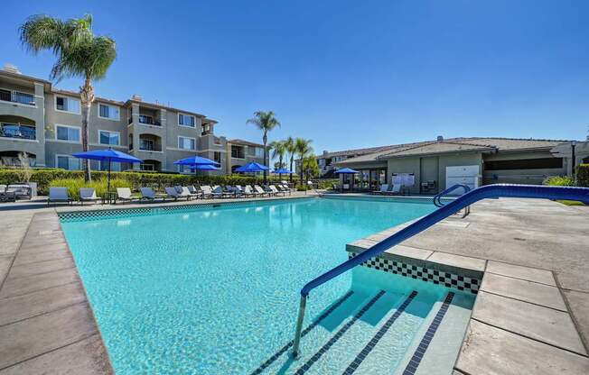 A swimming pool with a slide in the middle of it.