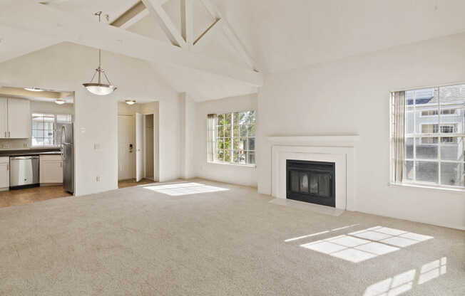 Carpeted Living Room with Fireplace and Patio