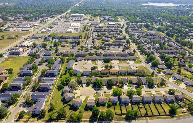 an aerial view of a suburban neighborhood with houses and trees