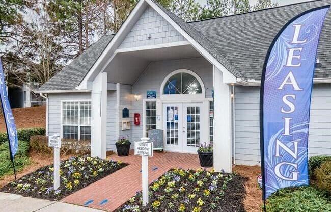 a house with a blue sign in front of it at The Sapphire, Decatur