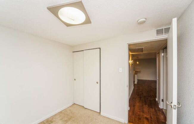 Bedroom with plush carpeting