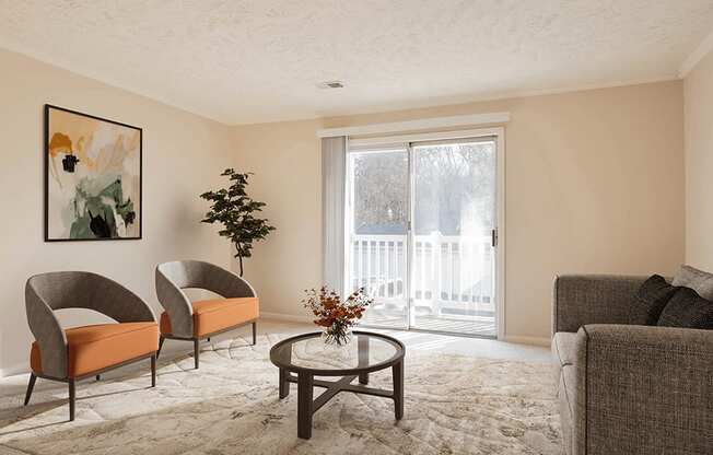 a living room with two chairs and a coffee table