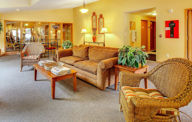 a living room with couches and chairs and a table