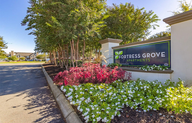 a sign at the entrance of fortress grove apartments