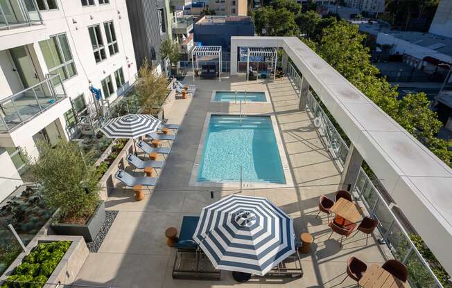 an aerial view of the outdoor pool and lounge area at the ace hotel los angeles