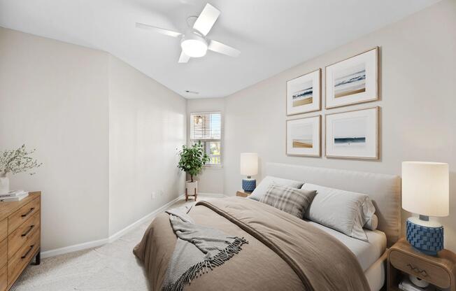 Bedroom with vaulted ceilings, soft neutral finishes, and natural light that creates a comfortable retreat.