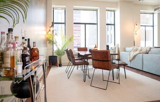 a dining room with a table and chairs and a living room