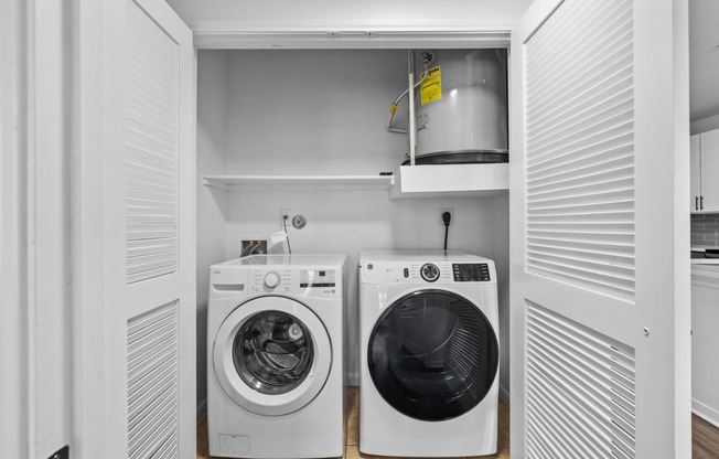 a small laundry room with a washer and a dryer