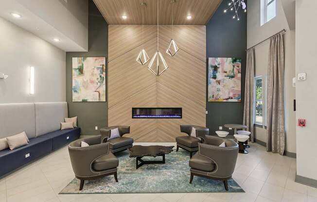 A modern living room with a fireplace and comfortable seating.