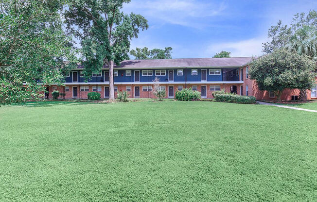 The Jaunt Apartments in Charleston South Carolina photo of exterior community building with grassy area