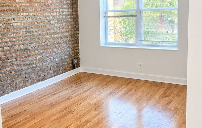 West Rogers Park Apartments With In-Unit Laundry and Exposed Brick
