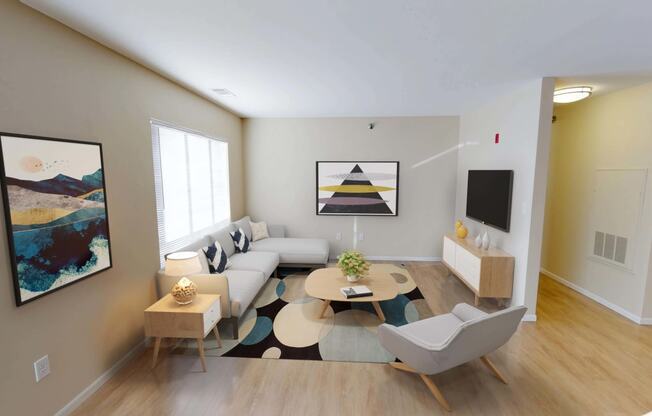 Open living space with bright natural light from large window on left wall.