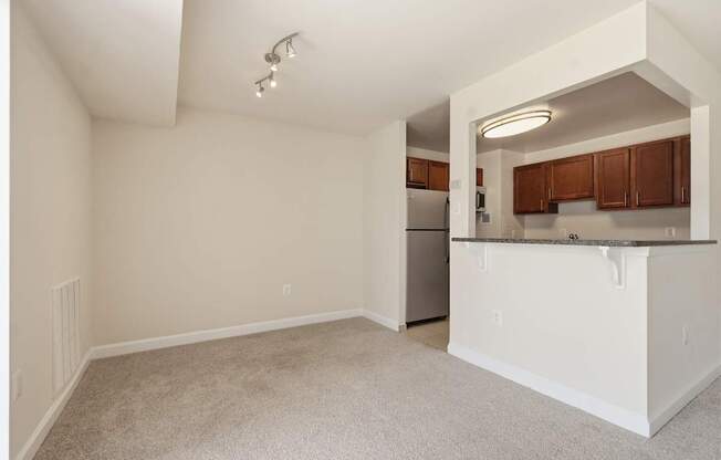 A kitchen area with a countertop and cabinets.