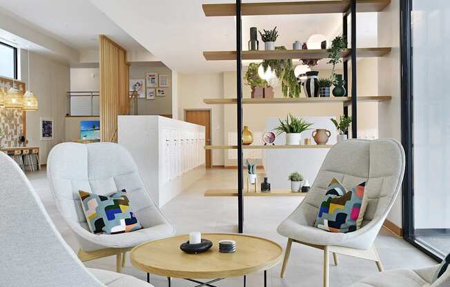 A modern living room with a white chair and a wooden table.