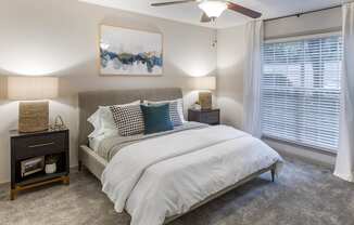 a bedroom with a bed and a ceiling fan at Roswell Village, Roswell, GA