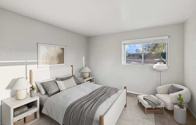 Model Bedroom with Carpet and Window View at Tanque Verde Apartments located in Tucson, AZ.
