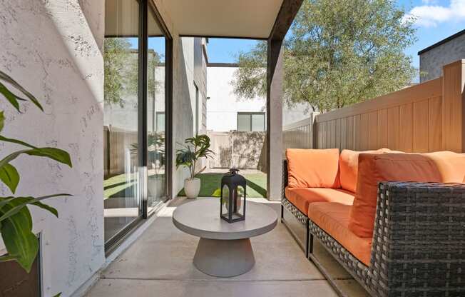 a patio with a couch and a table