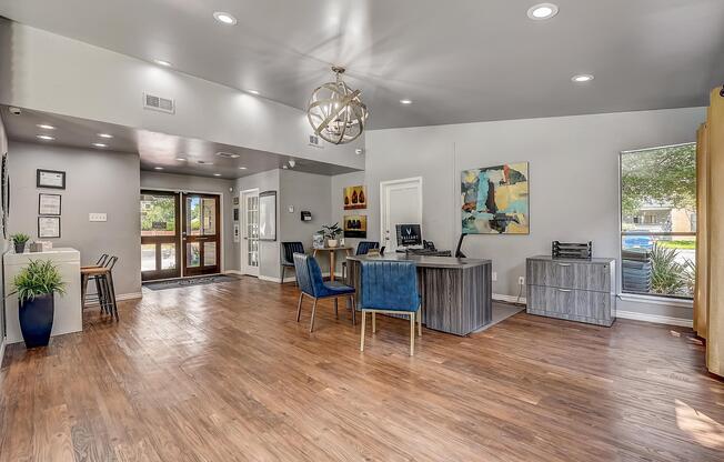 a living room filled with furniture and a large window