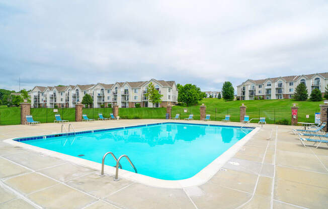 Outdoor Pool with Lounge Chairs at West Hampton Park Apartment Homes, Elkhorn, 68022