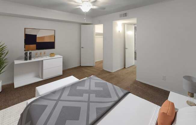 This is a photo of a virtually staged bedroom in the 751 square foot 1 bedroom, 1 bath apartment with fireplace at Woodbridge Apartments in Dallas, TX.