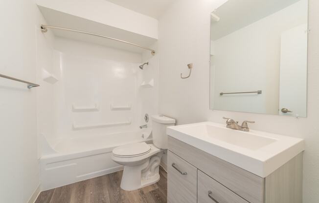 a bathroom with a sink toilet and bathtub in a 555 waverly unit