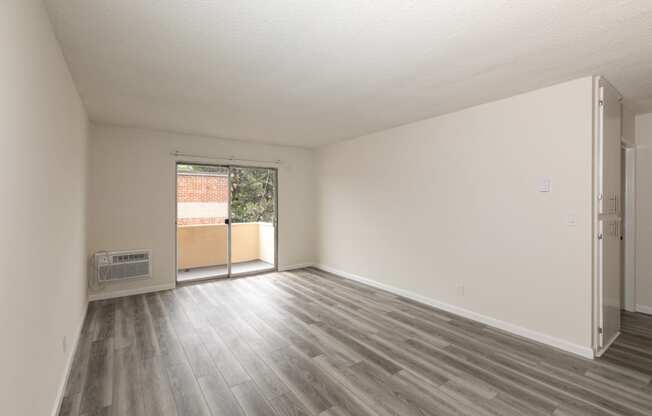 Living Room with Hardwood Floors and Patio Doors