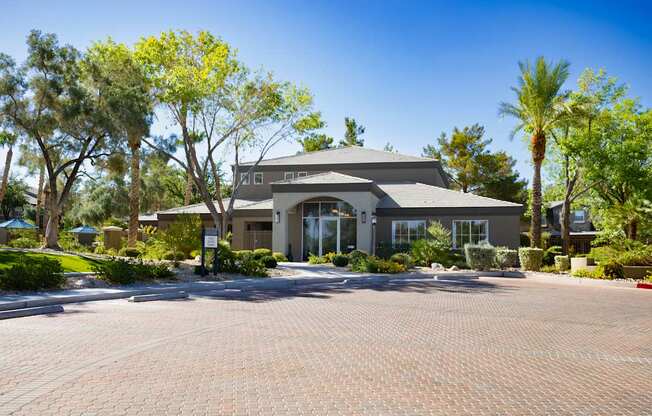 The Summit by Picerne's front office surrounded by trees.