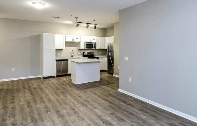 Spacious living room with an open floor plan at Legacy Commons Apartments in Omaha, NE