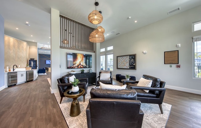 a living room with couches and chairs and a fireplace