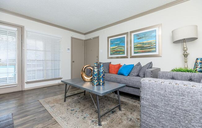 furnished living room with wooden floors
