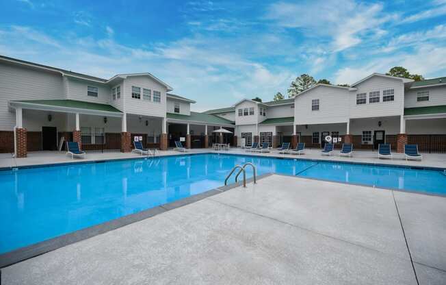 our apartments have a large swimming pool with lounge chairs