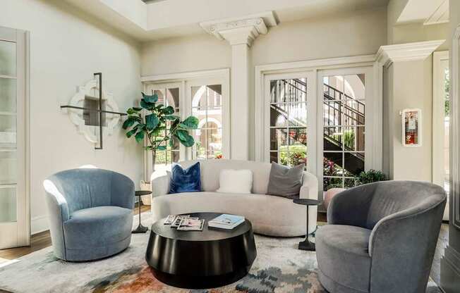 Modern clubhouse lounge with comfortable seating and natural light creating a welcoming atmosphere.