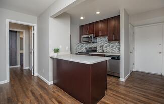 a kitchen with a wood floor