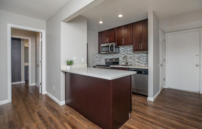 a kitchen with a wood floor