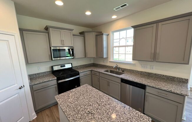 LIKE NEW 4 Bedroom Home w/ Ground Floor Bedroom