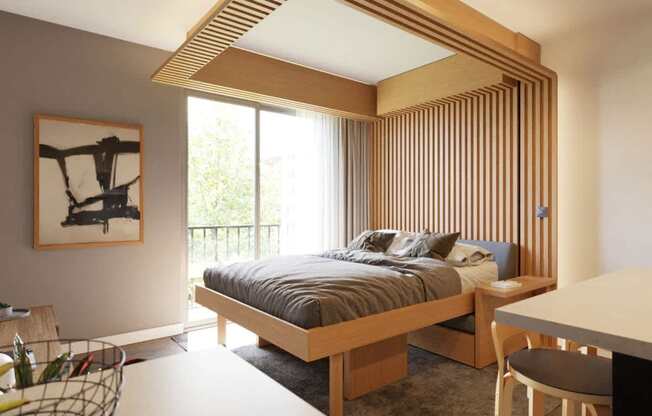 A bedroom with a bed, desk, and chair.