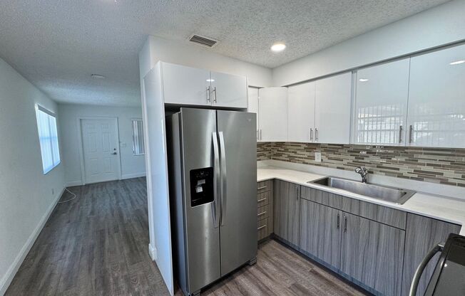ROISMAN, AVRAHAM M TRSTEE ETAL - 100 SW 9 St