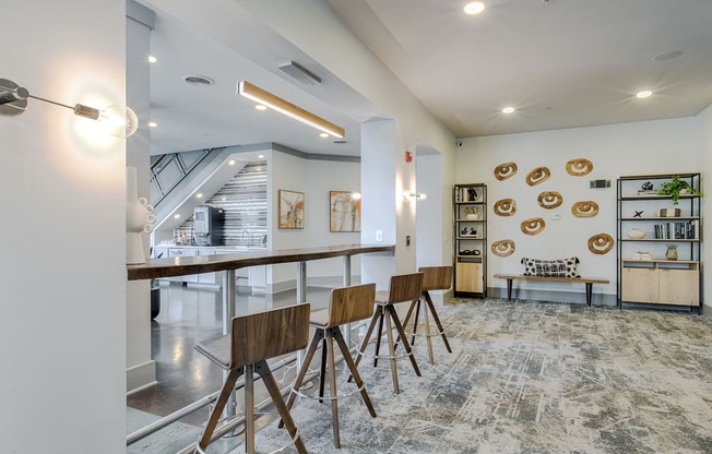 A modern kitchen with a dining table and chairs.