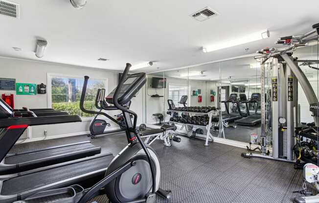 Fitness center with cardio machines like an elliptical at Oakley Run apartments in Smyrna, GA