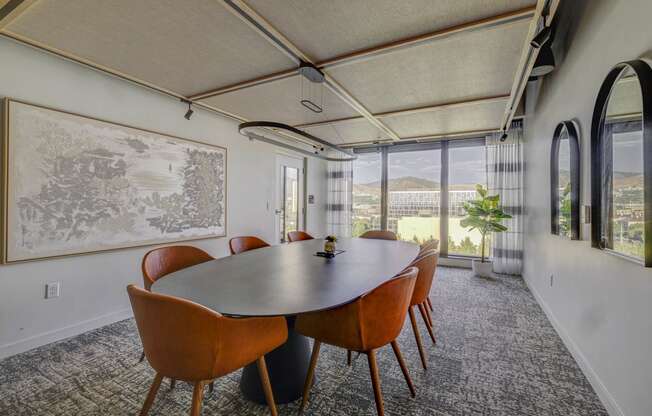 a meeting room with a large table and chairs