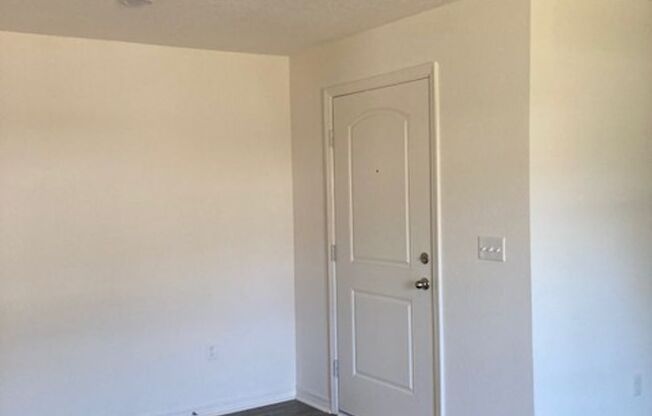 Like New 4/2/2 with screened in porch.