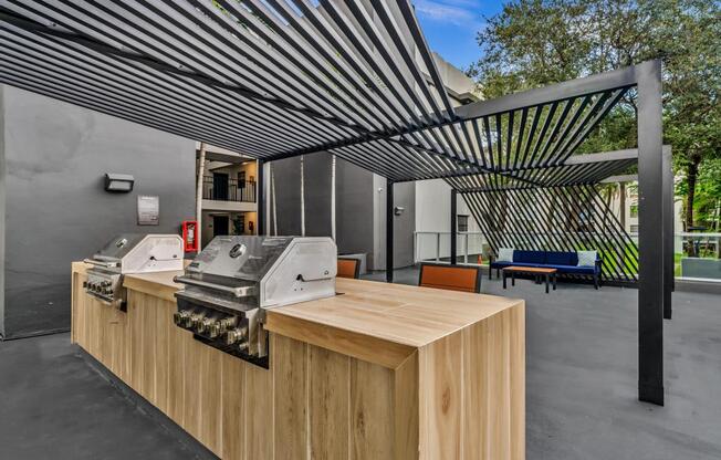 A large wooden table with a metal roof structure above it.