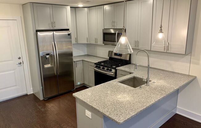 Stunning 2-Bed Condo with Private Roof Deck in Norris Square! Available mid-July!