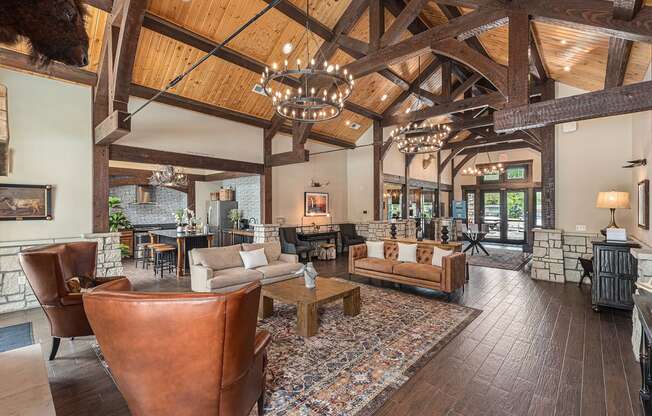 a living room filled with furniture and a large chandelier