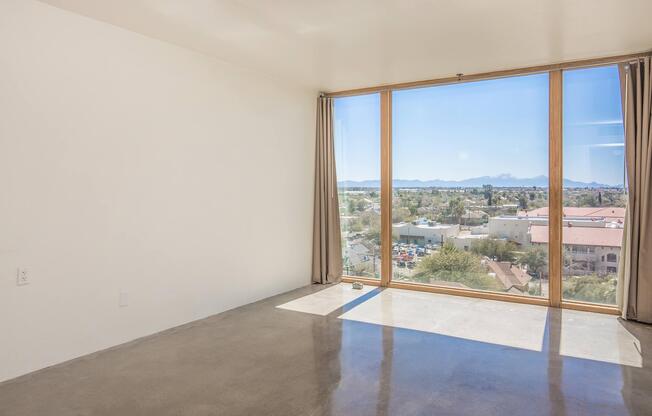 a view of a bedroom next to a window