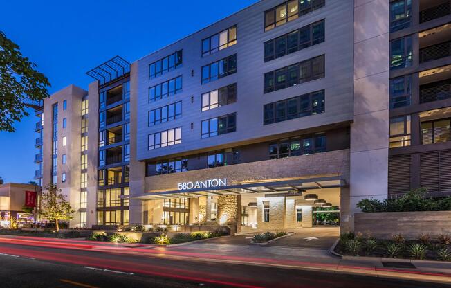 Evening exterior with illuminated entry for a welcoming arrival.