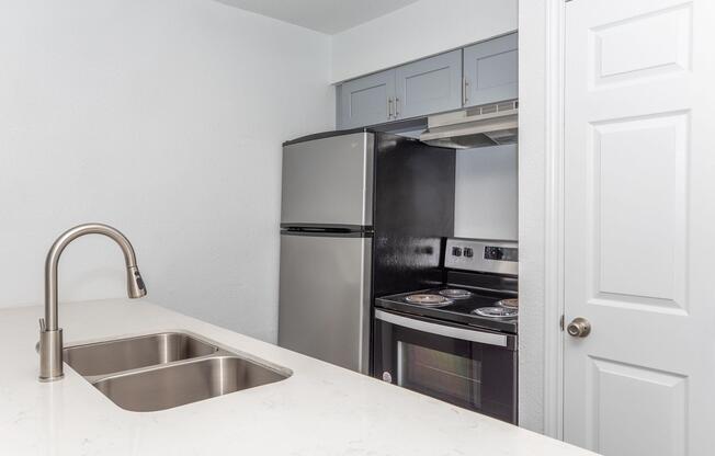 a kitchen with a sink and a window