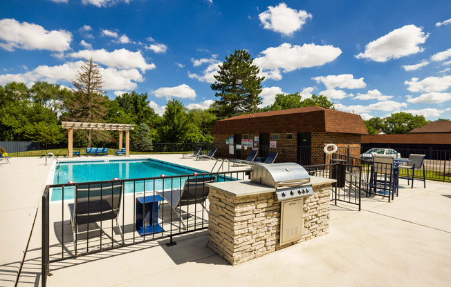 outdoor grilling station near a swimming pool
