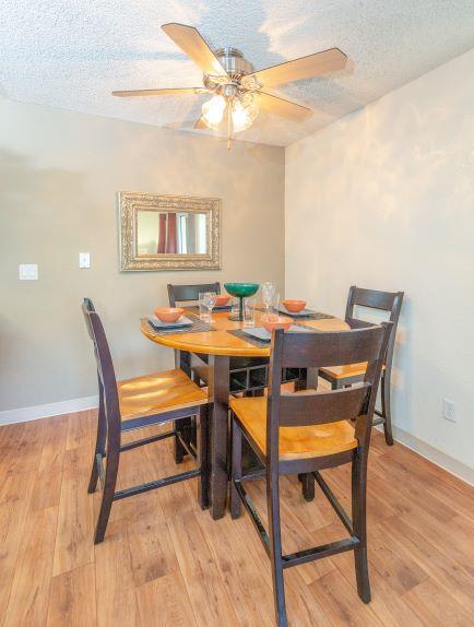 Dining Room with Hardwood Style Flooring at Bent Tree Apartments, Sacramento, 95842