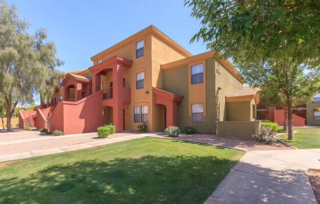Building Exterior View with Lawn Area at San Lucas Apartments, Tolleson, 85353